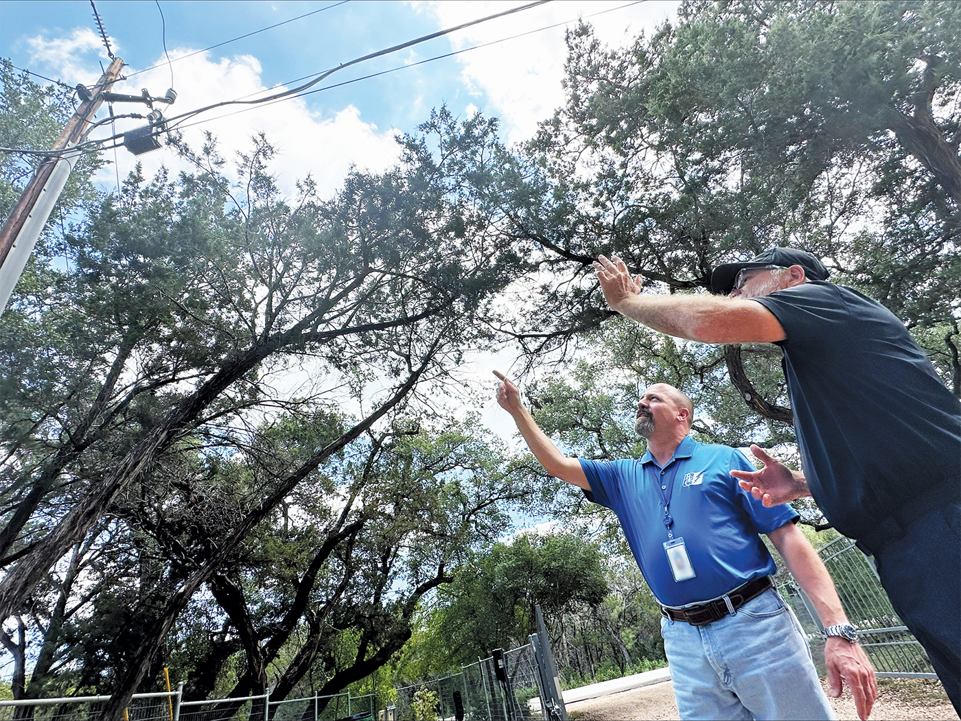 Photo of PEC vegetation maintenance representative speaking with PEC member