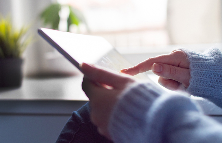 Person using digital tablet