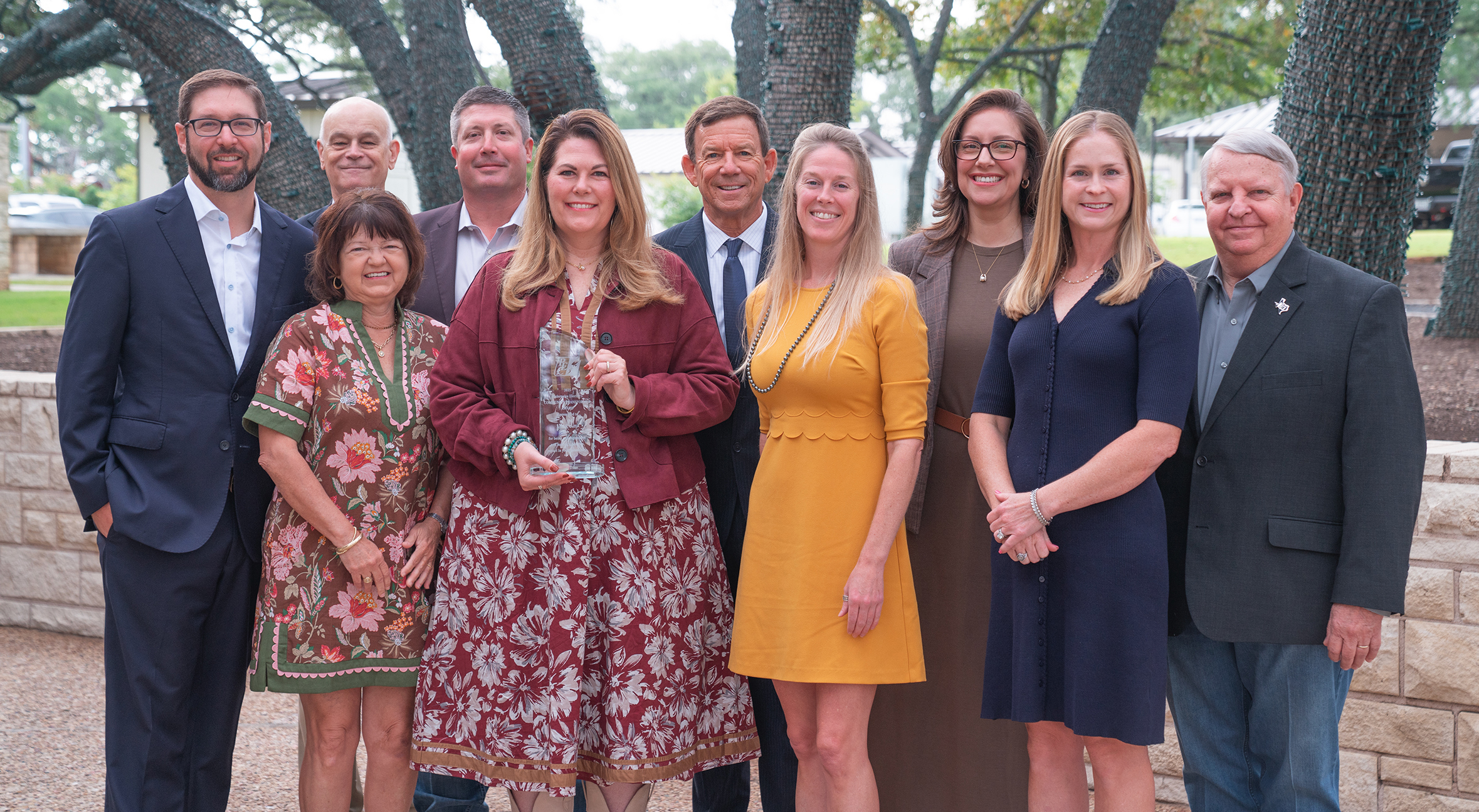 Photo of Community Transformer award recipient, Anne Duffy, with PEC Board of Directors at PEC's headquarters in Johnson City.