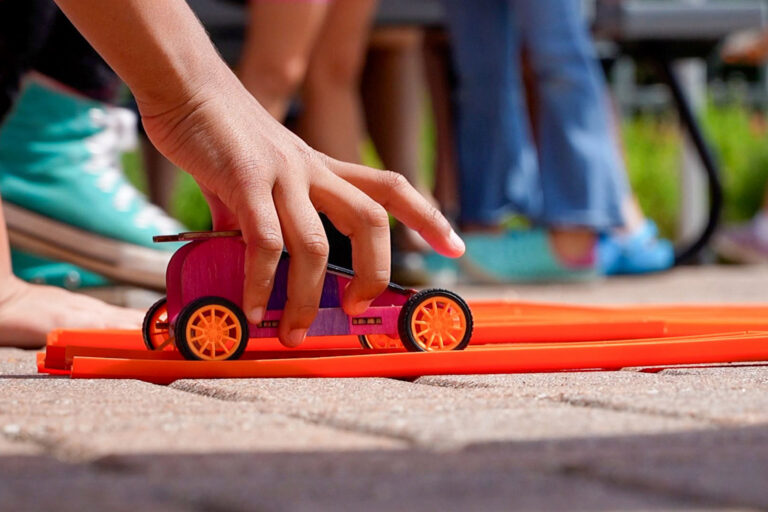 Photo of solar derby car with hand on it
