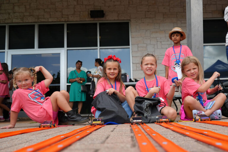 Photo of four girls at solar derby track