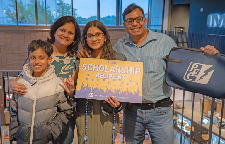 Photo of PEC scholarship recipient with family