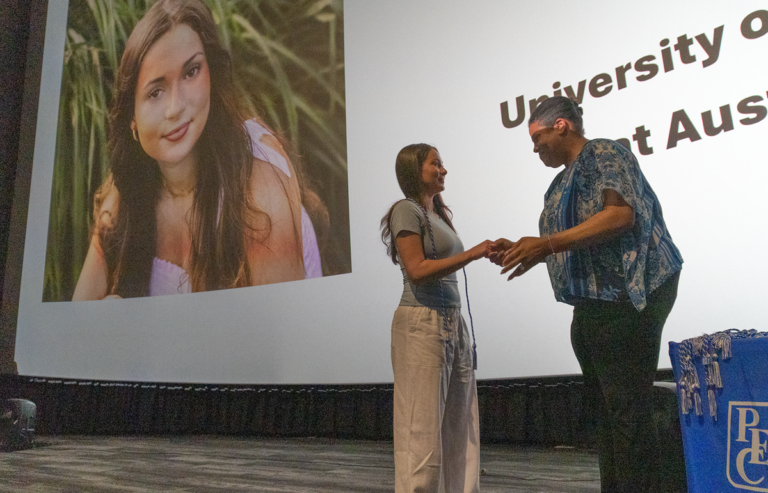 Photo of scholarship recipient receiving award