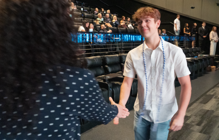 Photo of scholarship recipient receiving award