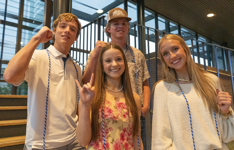 Photo of scholarship recipients standing on stairs